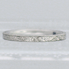Palladium flat band with hand-engraved flowers and vines pattern