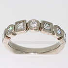 14 Karat White Gold hand-engraved bezels band with alternating round and princess-cut diamonds