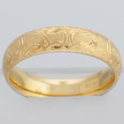 14 Karat Yellow Gold hand-engraved band with celtic infinity pattern